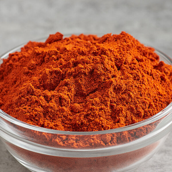 "Bright red cayenne pepper powder in a bowl, perfect for adding heat and flavor to recipes"

"Whole dried cayenne peppers with vibrant red color, ideal for seasoning and spice blends"

"Cayenne pepper spice sprinkled on a wooden spoon, known for its bold, spicy flavor"

"Fresh cayenne peppers on a rustic surface, packed with heat and rich in antioxidants"