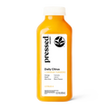 A bottle of Pressed Juice Daily Citus + Orange Turmeric juice, featuring a bright orange liquid, a white cap, and a white label with black and orange text, set against a plain white background.
