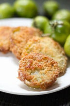 Add irresistible Southern flavor to your menu with Harvest Creations Dipt'n Dusted fried green tomatoes! These thick-cut, tart green tomatoes are coated in a seasoned blend of flour and cornmeal, delivering a crispy outer layer and juicy interior. Perfect as a shareable appetizer, side dish, or unique burger topping, these fried green tomatoes will keep guests coming back for more.

Par-fried for easy freezer-to-fryer preparation, simply fry 9-15 pieces at 350°F for 2.5 to 3.5 minutes. This product includes