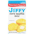 Box of Jiffy corn muffin mix with a picture of corn muffins on a white background