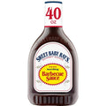 A 40 oz bottle of Sweet Baby Ray's Barbecue Sauce on a plain white background. The bottle is dark brown, showing the thick sauce inside.